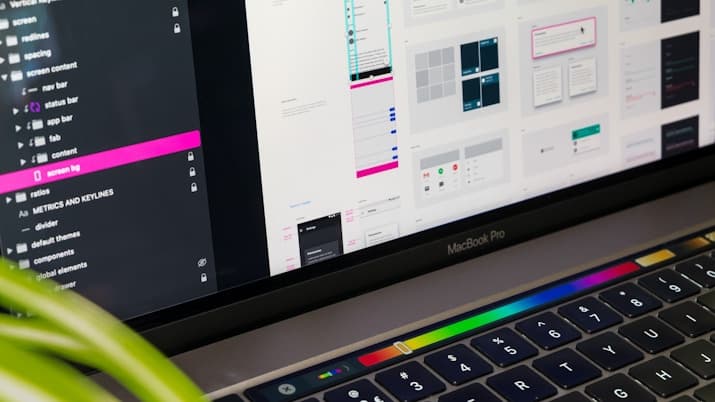 Design tool layers panel open on a laptop
